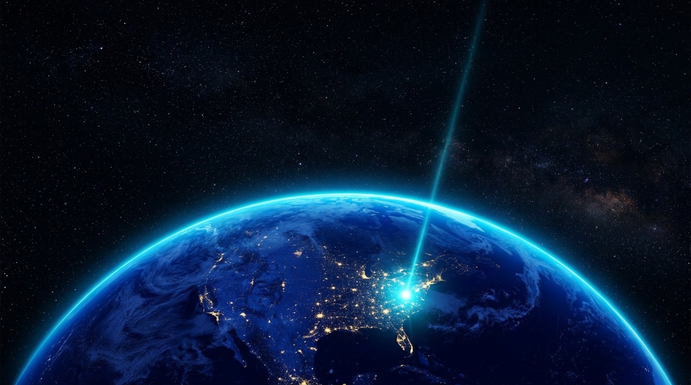 Earth from space at night, the Earth's Brew source glowing artesian-cyan over Virginia